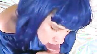 Blue wig crossdresser blowing