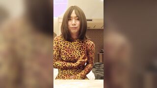 Chinese crossdresses dressed in leopard Morphsuit