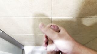 Milking off in the douche with powerful cum shot