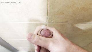 Milking off in the douche with powerful cum shot