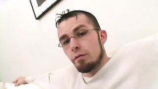 Twink wears sexy glasses while jerking off his thick cock