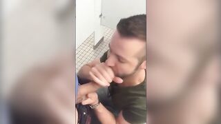 Handsome guy sucks dick in restroom stall74