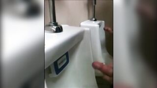 two slim dicks getting wanked at the urinals123