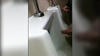 two slim dicks getting wanked at the urinals123