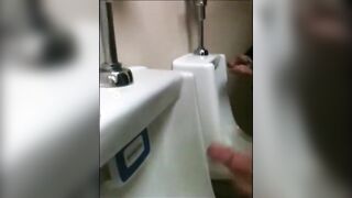 two slim dicks getting wanked at the urinals123