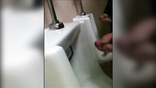 two slim dicks getting wanked at the urinals123