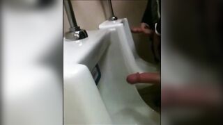 two slim dicks getting wanked at the urinals123