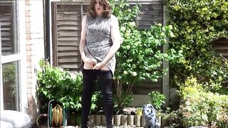 Sexy masturbating crossdresser in thigh boots outdoors