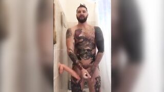 Tattooed Wolf Romps Faux-Cock in Bathroom Until He Spunks