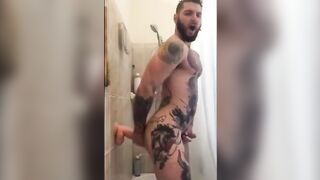 Tattooed Wolf Romps Faux-Cock in Bathroom Until He Spunks