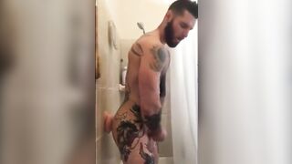 Tattooed Wolf Romps Faux-Cock in Bathroom Until He Spunks