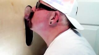 Horny dude with glasses enjoys in a glory hole scene