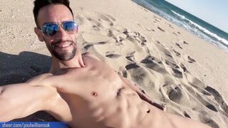 Gym trainer gets nude on a public beach in Spain