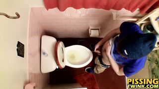 Devin Reynolds grabs his cock and unloads in the toilet