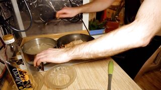 Beautiful cooking. Bare shirtlifter chef is cooking rice noodle with chicken and vegetables