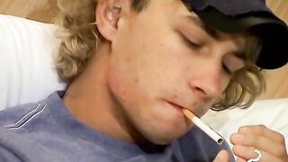 Blonde twink Casey Wood jerks off his dong while smoking