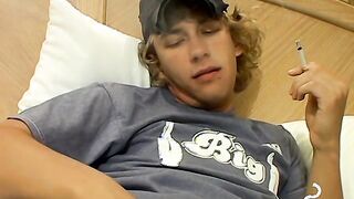 Blonde twink Casey Wood jerks off his dong while smoking