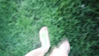 Jon Arteen in brief cutoffs ambles on grass bootless, displays his fellow feet, grins for you