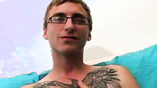 Geeky amateur with glasses and tattoos strokes his big cock