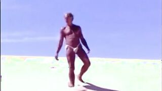 Tanned guy on beach in tiny string thong (temporarily!)