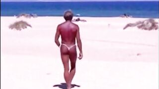 Tanned guy on beach in tiny string thong (temporarily!)