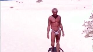 Tanned guy on beach in tiny string thong (temporarily!)